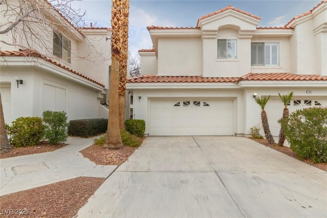 mediterranean / spanish house with a garage