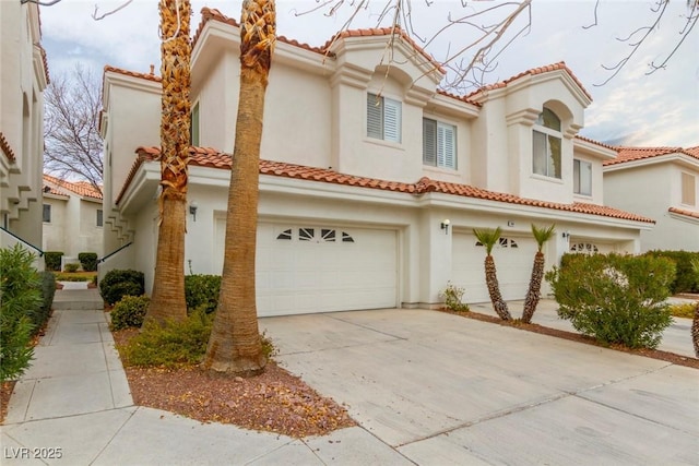 mediterranean / spanish-style house featuring a garage