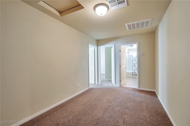 spare room with light colored carpet