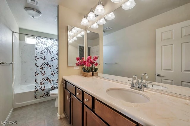 full bathroom with tile patterned floors, toilet, vanity, and shower / bath combo