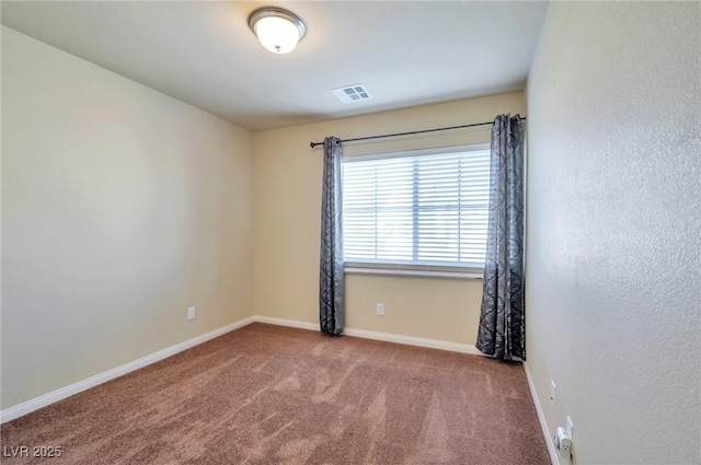 spare room featuring carpet flooring