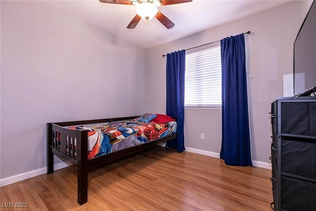 bedroom with hardwood / wood-style flooring and ceiling fan