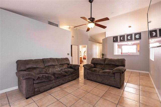 tiled living room with ceiling fan and lofted ceiling