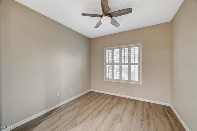 unfurnished room with ceiling fan and light wood-type flooring