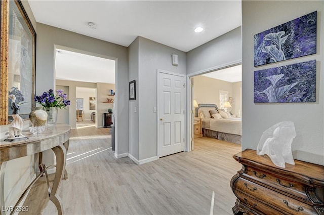 hall with light hardwood / wood-style floors