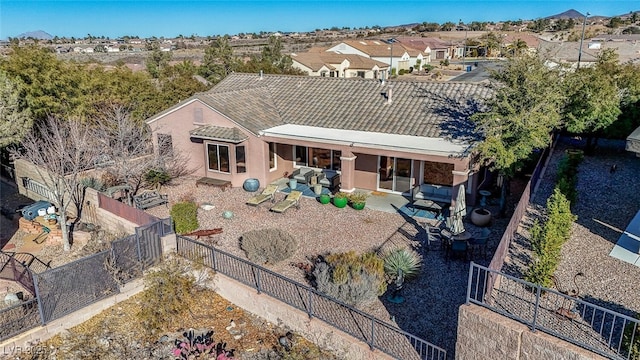 rear view of property featuring a patio area