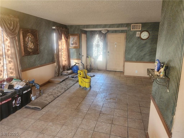 miscellaneous room featuring a textured ceiling