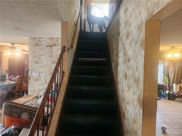 stairs with tile patterned floors and a textured ceiling