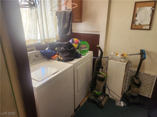 laundry area featuring washing machine and clothes dryer