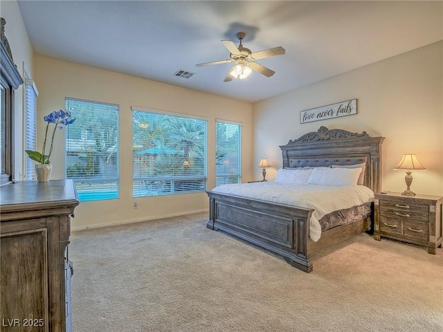 bedroom with light colored carpet and ceiling fan