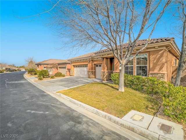 view of front of house with a garage and a front yard