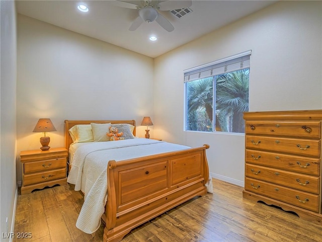 bedroom featuring ceiling fan and light hardwood / wood-style flooring