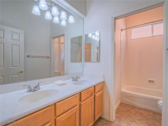 full bathroom with vanity, toilet, tile patterned flooring, and shower / bathing tub combination