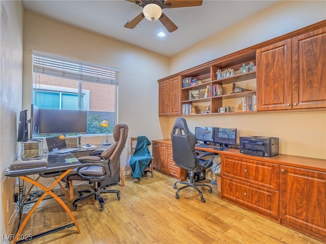 home office featuring light hardwood / wood-style flooring and ceiling fan