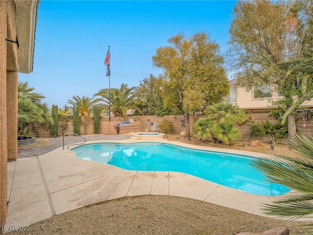 view of pool featuring an in ground hot tub and a patio