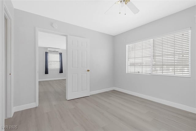 spare room featuring ceiling fan and light hardwood / wood-style floors