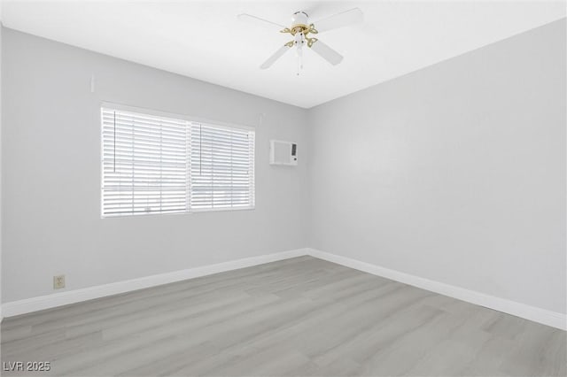 unfurnished room featuring ceiling fan and light wood-type flooring