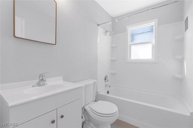 full bathroom with vanity, toilet, and washtub / shower combination