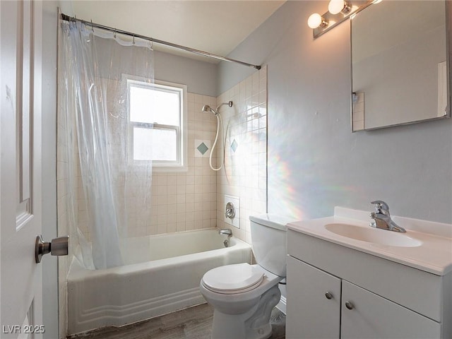 full bathroom with vanity, hardwood / wood-style floors, toilet, and shower / bath combo with shower curtain