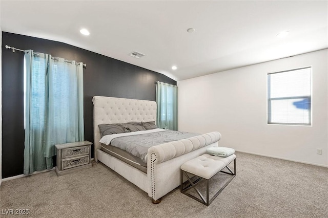 bedroom with lofted ceiling and carpet