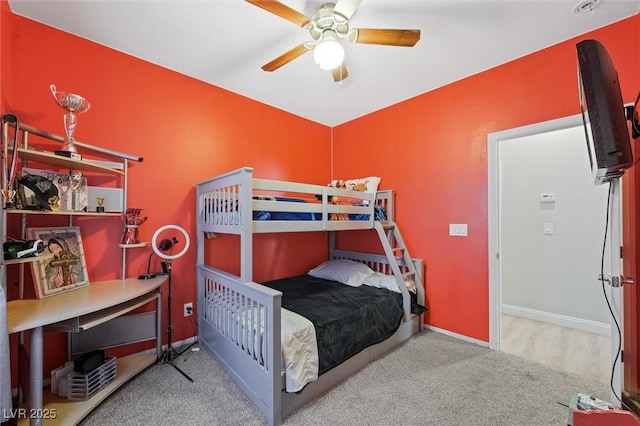 carpeted bedroom featuring ceiling fan