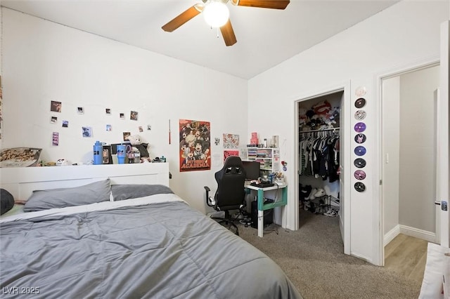 carpeted bedroom featuring a spacious closet, ceiling fan, and a closet