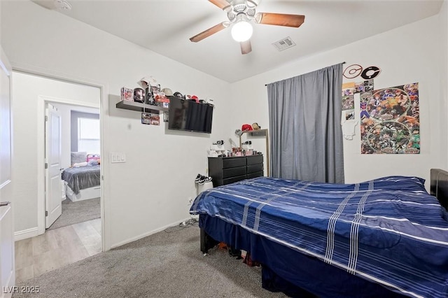 carpeted bedroom with ceiling fan