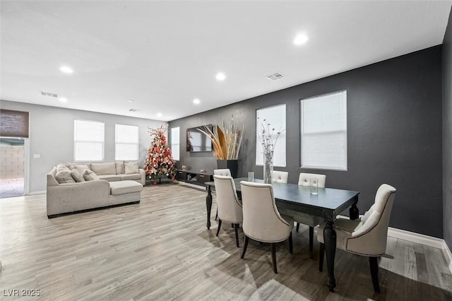 dining area with light hardwood / wood-style floors