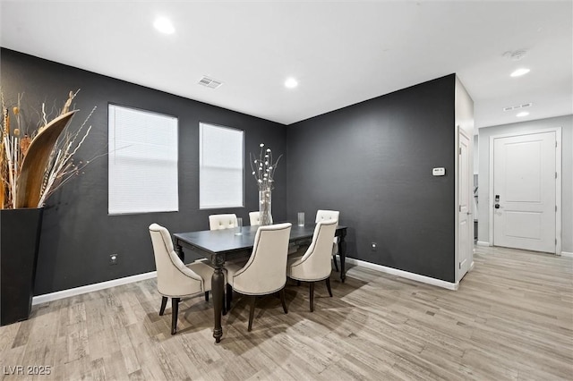 dining room featuring light hardwood / wood-style flooring