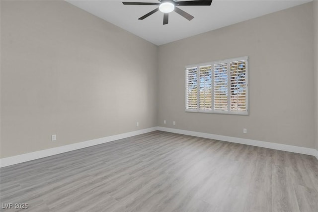 empty room featuring ceiling fan and light wood-type flooring