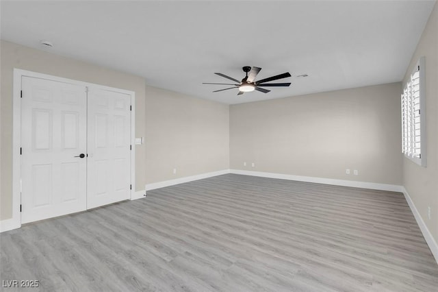 spare room with ceiling fan and light hardwood / wood-style flooring