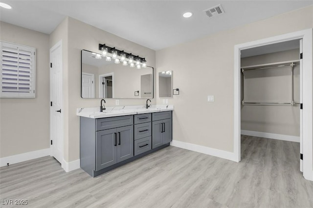 bathroom featuring vanity and hardwood / wood-style floors