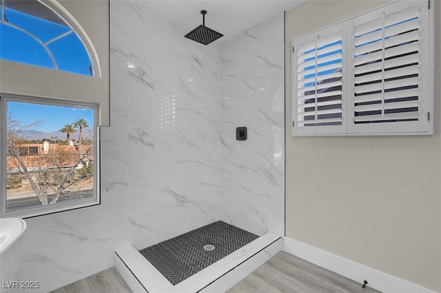 bathroom with tiled shower