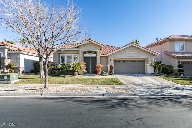 mediterranean / spanish-style house featuring a garage