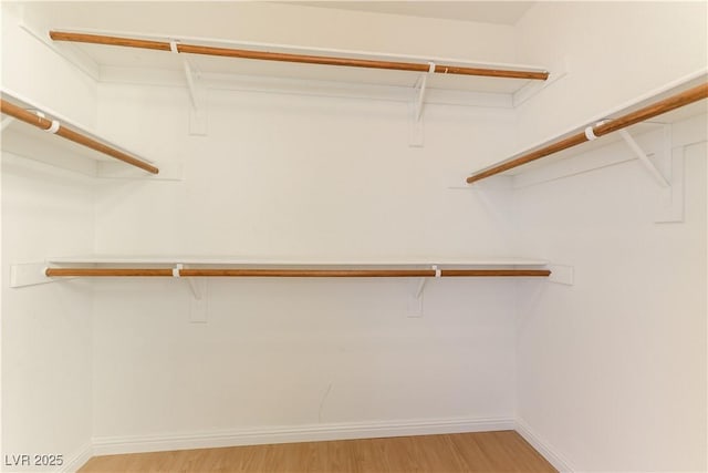 walk in closet featuring light wood-type flooring