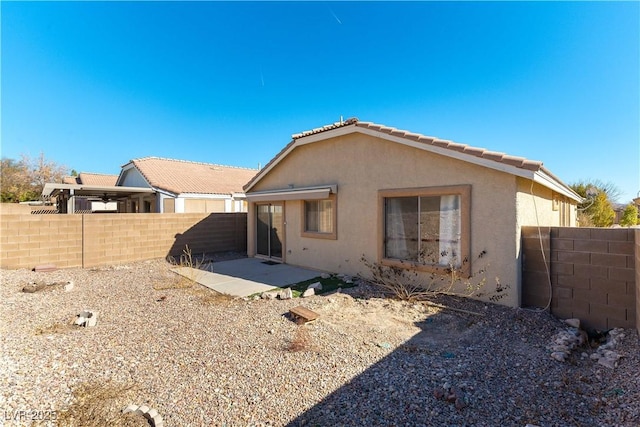 rear view of house featuring a patio area