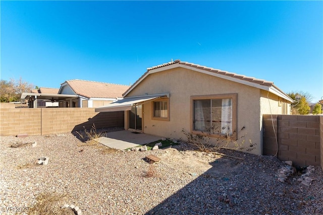 back of property with a patio area