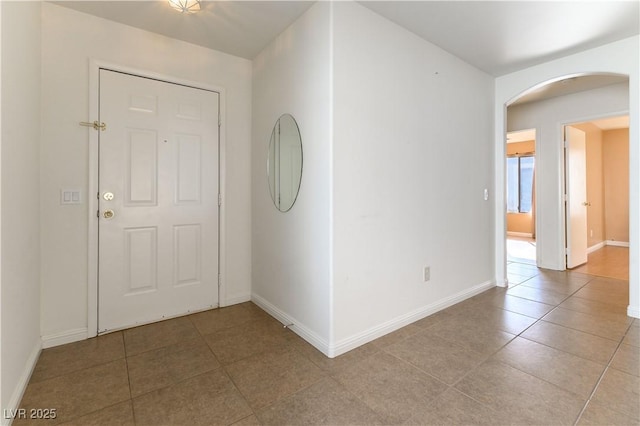 entrance foyer featuring light tile patterned floors