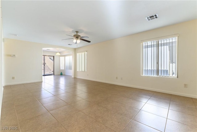 unfurnished room featuring ceiling fan and light tile patterned floors