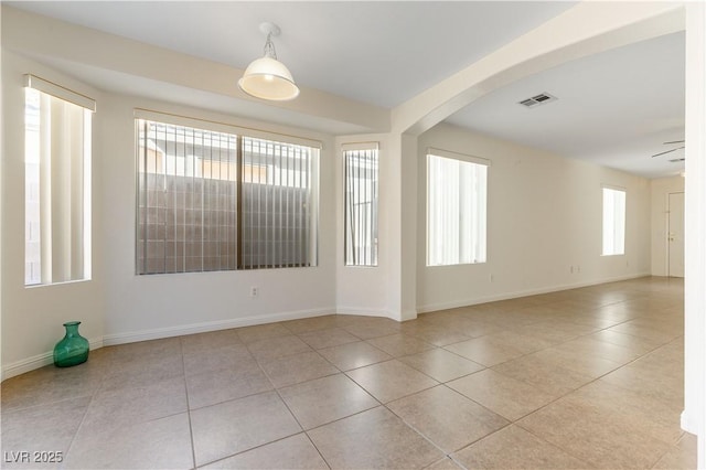 unfurnished room featuring light tile patterned floors