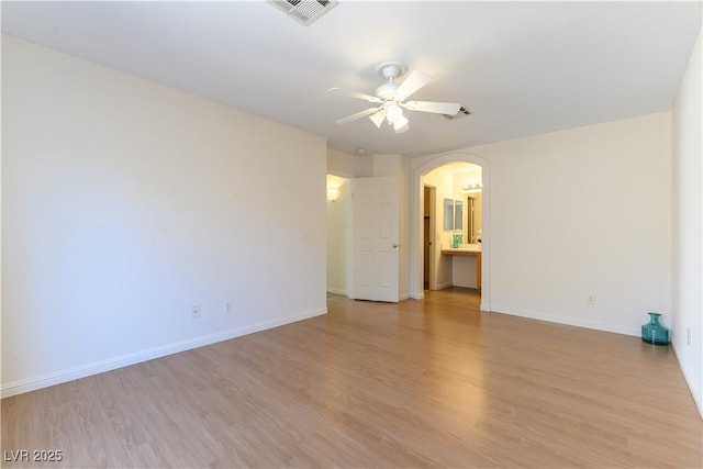 empty room featuring ceiling fan and light hardwood / wood-style floors