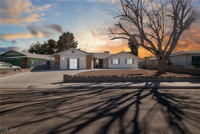 ranch-style home with a garage