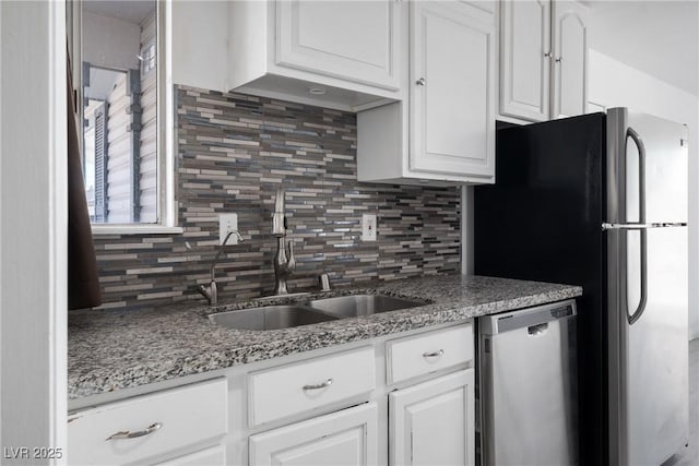 kitchen with white cabinetry, sink, backsplash, and stainless steel appliances