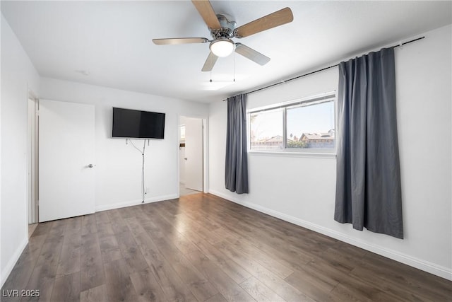 interior space with ceiling fan and wood-type flooring