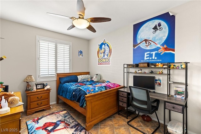 tiled bedroom featuring ceiling fan