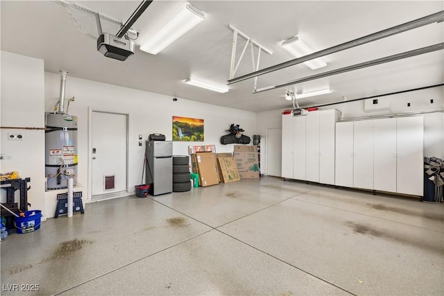 garage with a garage door opener and strapped water heater