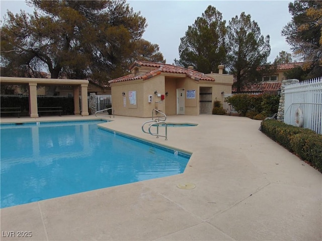 view of swimming pool with a patio area