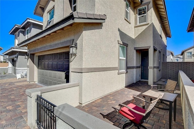 view of patio with a garage