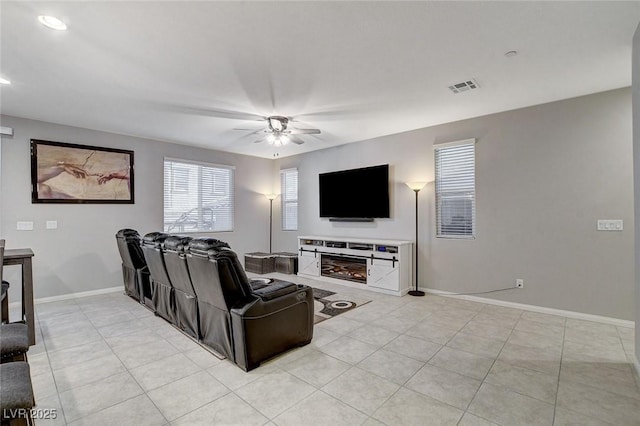 tiled living room featuring ceiling fan