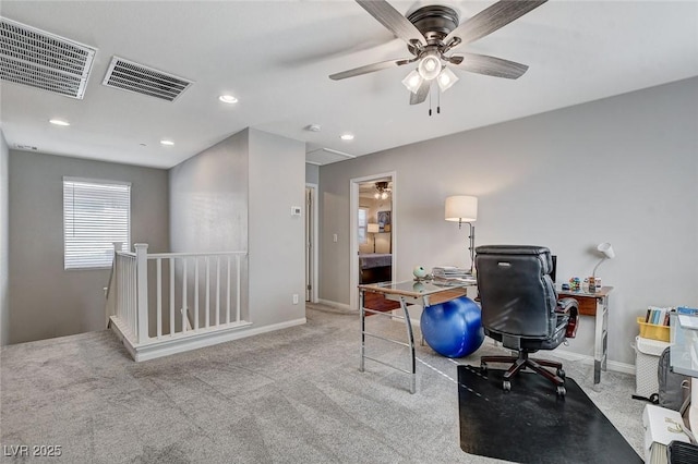 carpeted office with ceiling fan